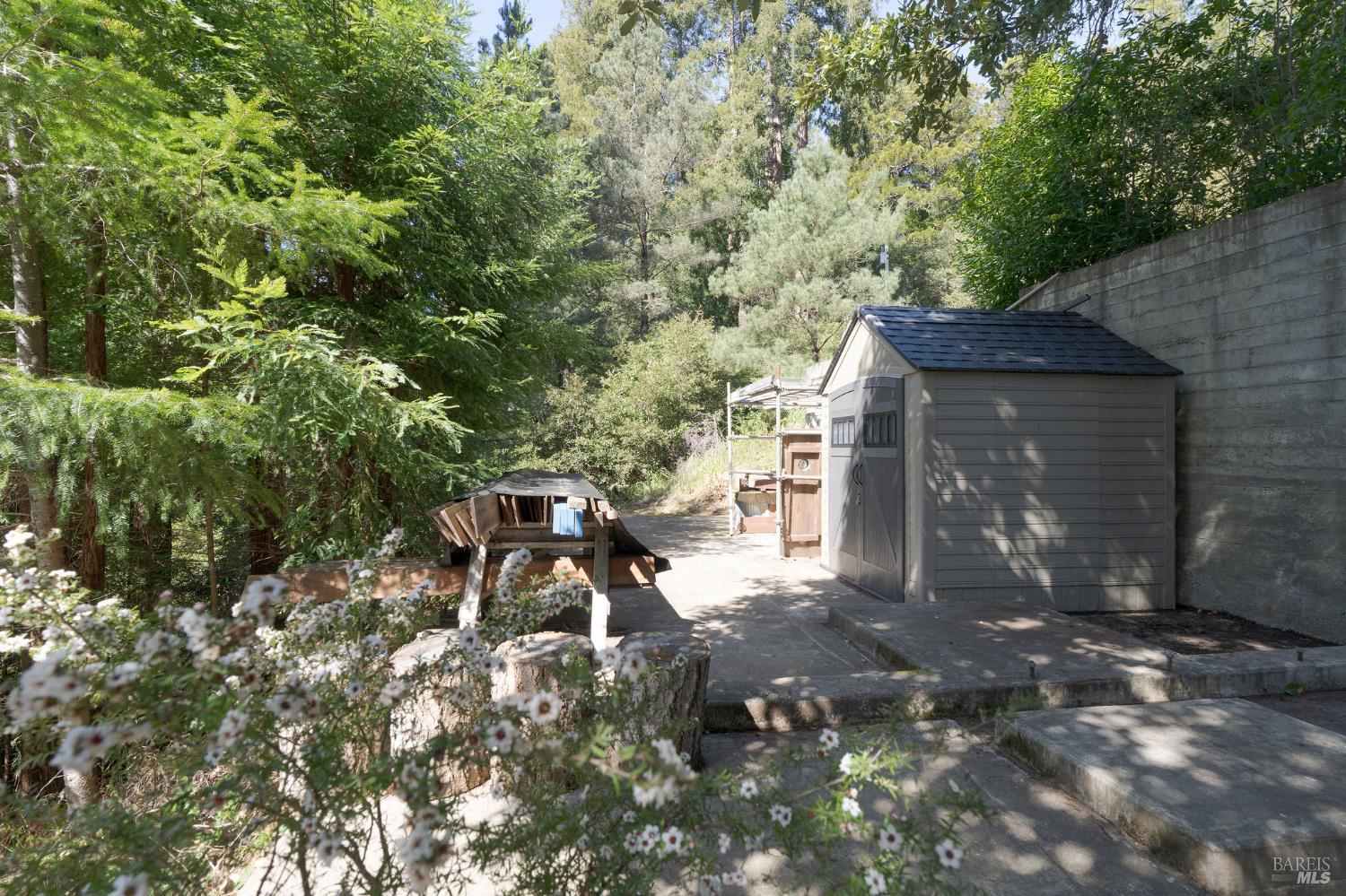 35570 Ocean View Street Gualala, CA 95445 - Photo 47 of 52 a backyard of a house with table and chairs