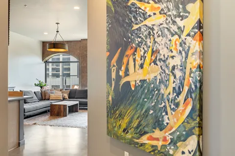 a kitchen with a sink and a living room