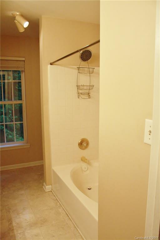 7311 Henderson Park Road Huntersville, NC 28078 - Photo 12 of 23 a bathroom with a shower and a bath tub