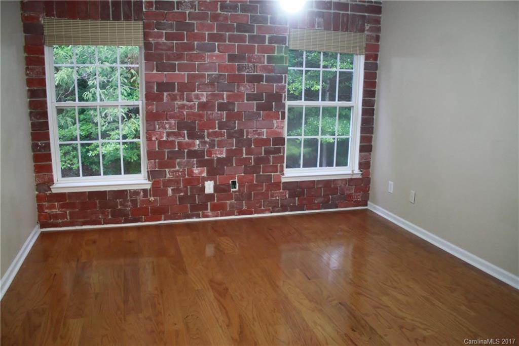 7311 Henderson Park Road Huntersville, NC 28078 - Photo 15 of 23 a view of an empty room with wooden floor and a window