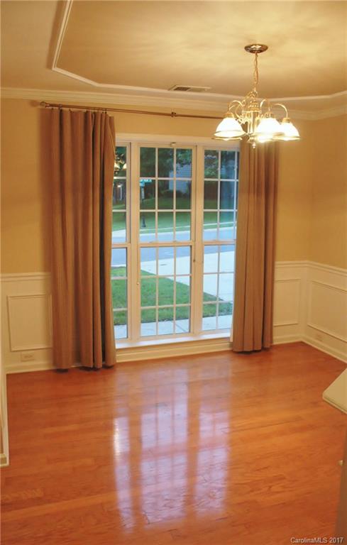 7311 Henderson Park Road Huntersville, NC 28078 - Photo 4 of 23 a view of a room with wooden floor and windows