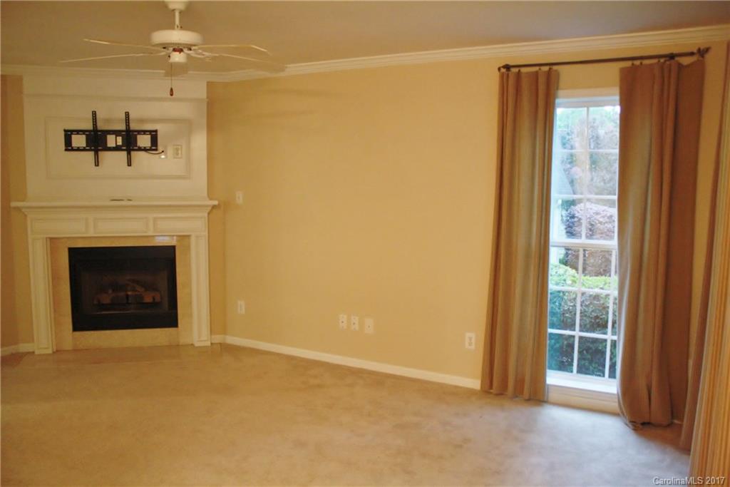 7311 Henderson Park Road Huntersville, NC 28078 - Photo 6 of 23 a view of an empty room with a fireplace