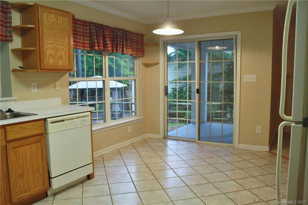 7311 Henderson Park Road Huntersville, NC 28078 - Photo 9 of 23 a view of a kitchen with furniture and windows