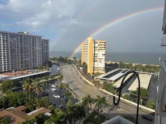 a view of a balcony with wooden floor