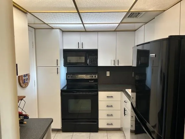 a kitchen with stainless steel appliances a refrigerator and a stove