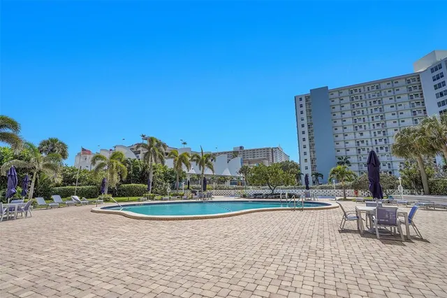 a view of outdoor space with swimming pool and lake view