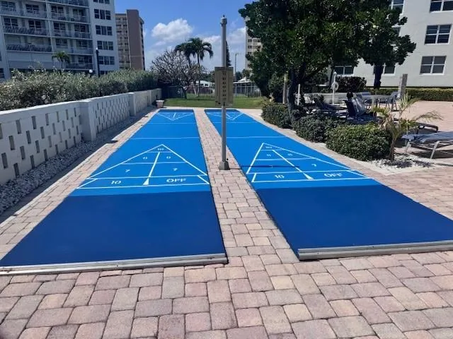 a living room with couches couches and a flat screen tv