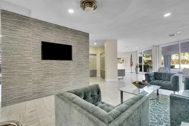 a view of a swimming pool with a yard and palm trees
