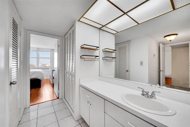 a bathroom with a sink and a mirror