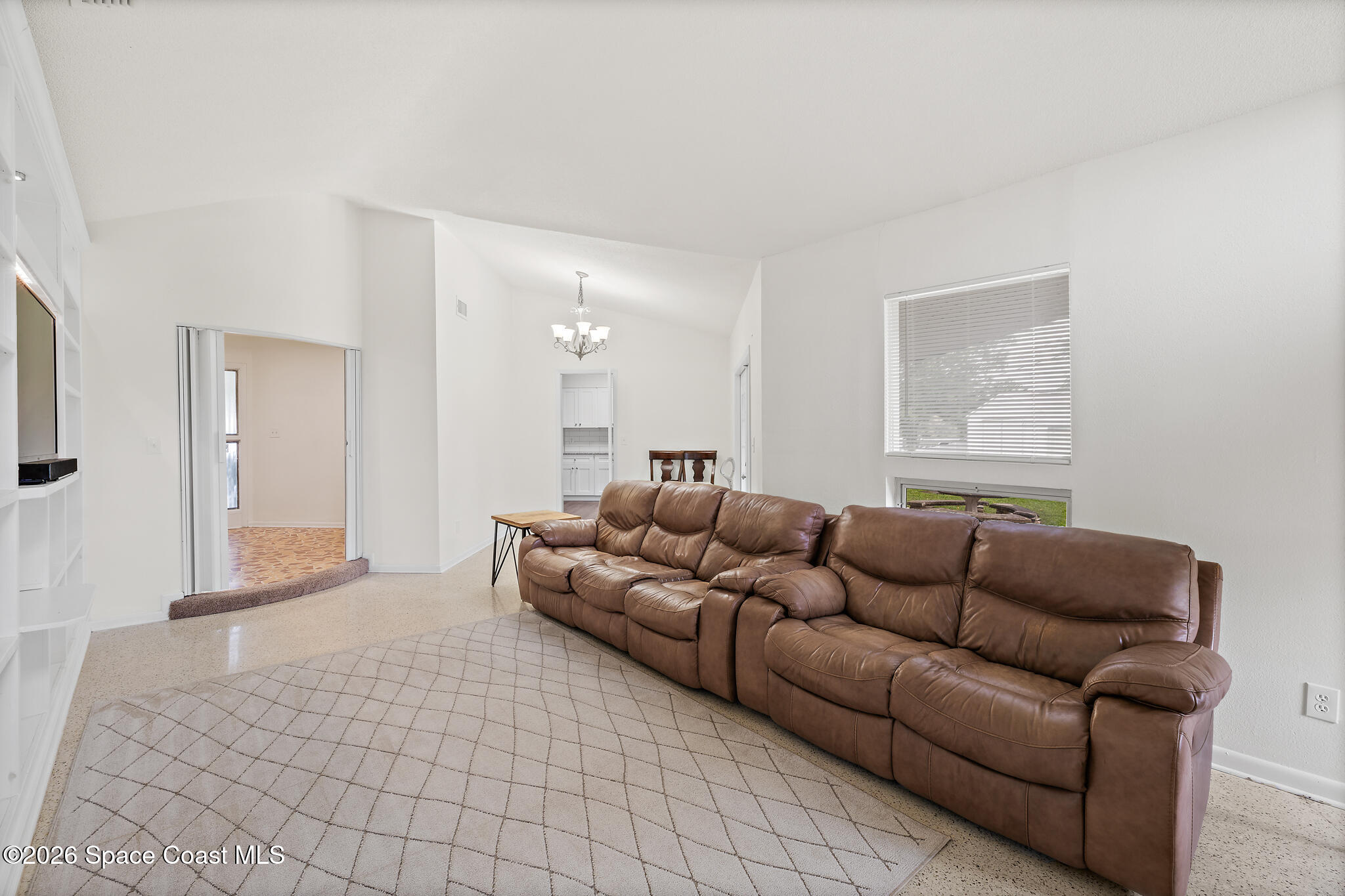 815 Glade Road Titusville, FL 32780 - Photo 11 of 30 a living room with furniture and a rug