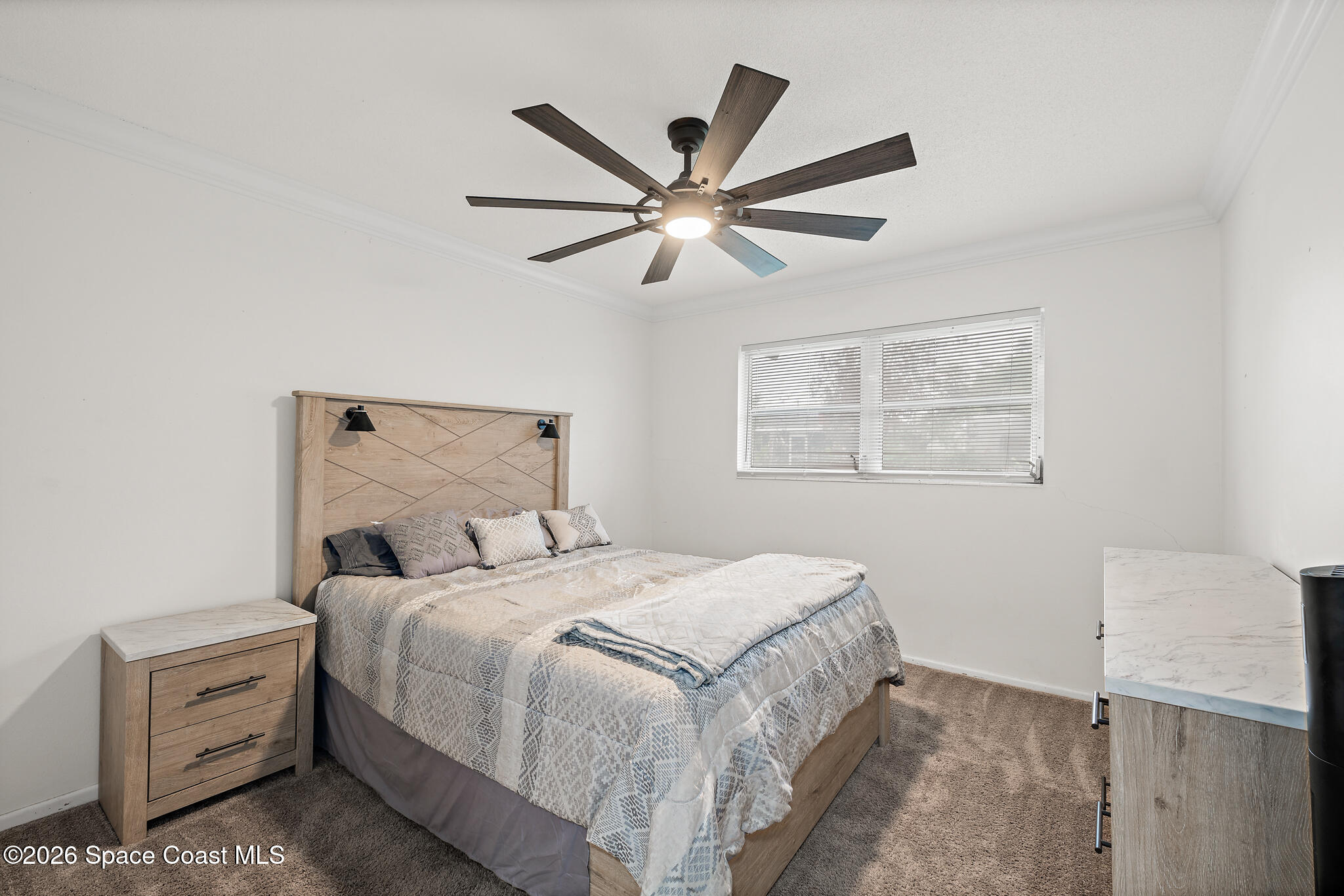 815 Glade Road Titusville, FL 32780 - Photo 16 of 30 a bedroom with a bed and a window