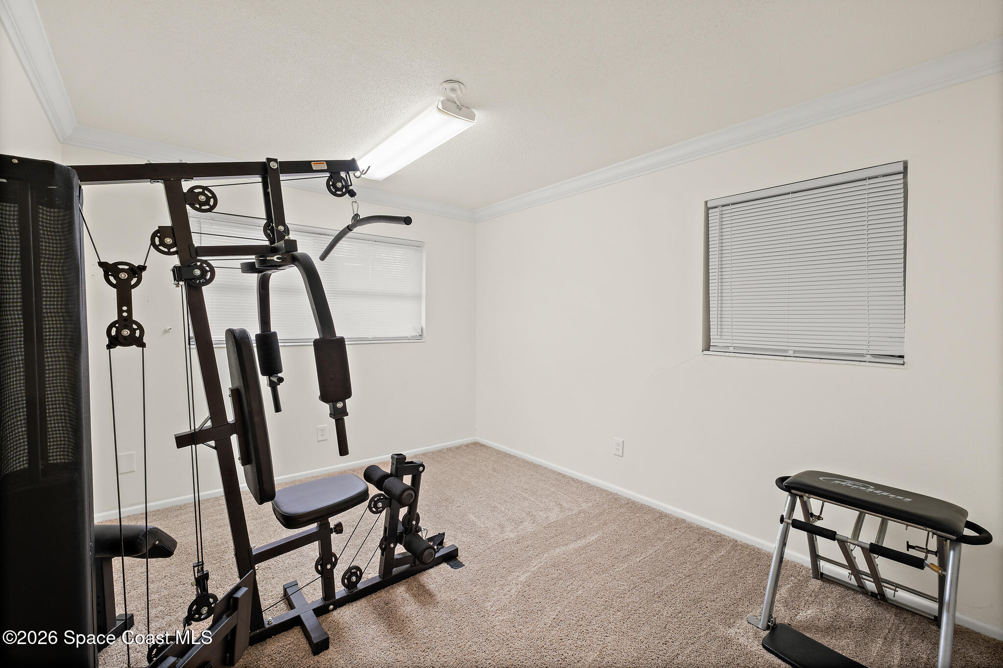 815 Glade Road Titusville, FL 32780 - Photo 19 of 30 a view of a room with gym equipment