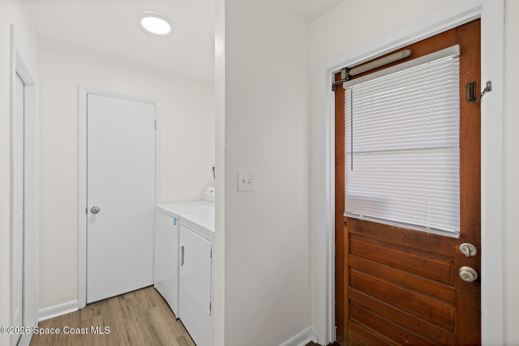 815 Glade Road Titusville, FL 32780 - Photo 20 of 30 a view of hallway with closet and wooden floor