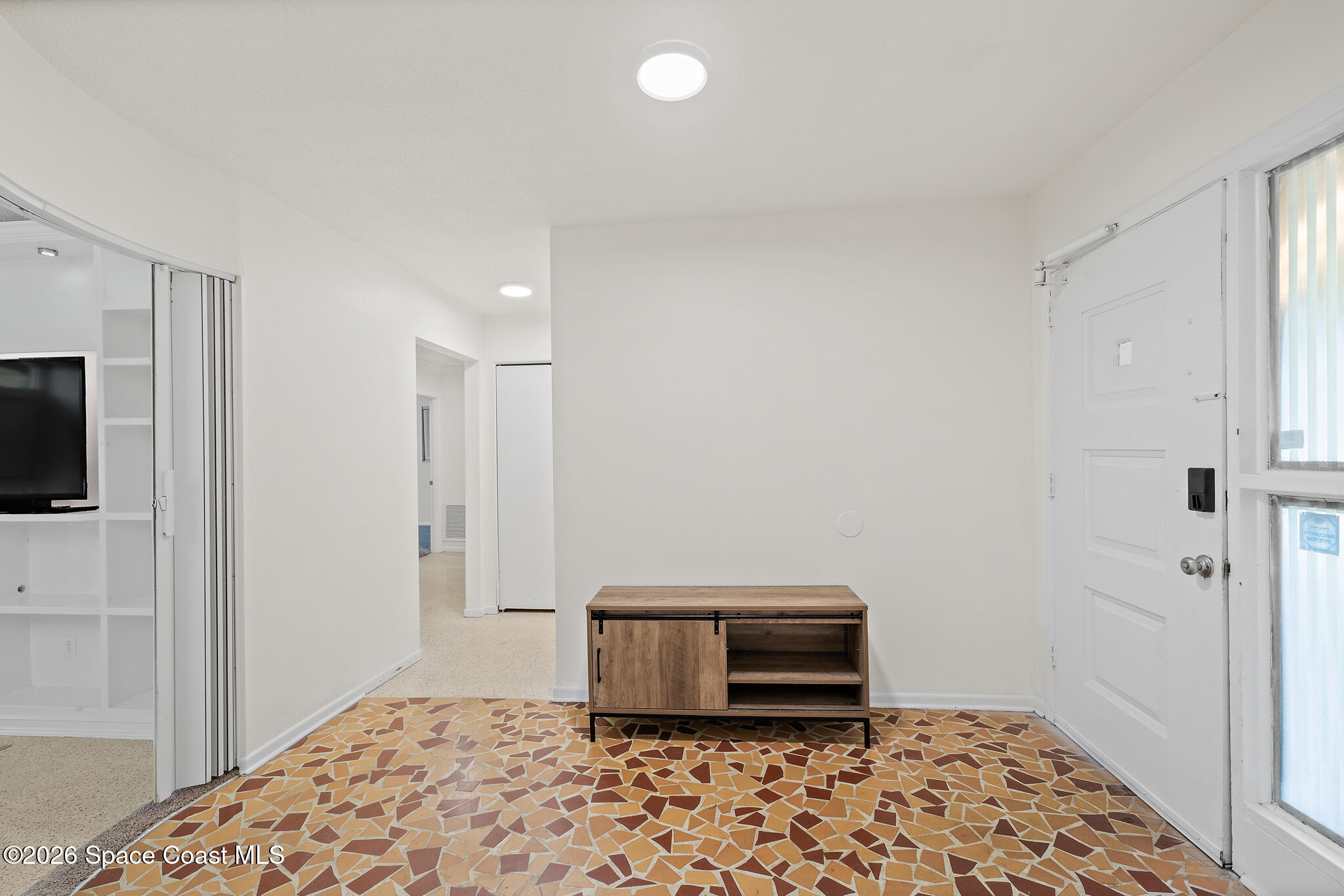 815 Glade Road Titusville, FL 32780 - Photo 22 of 30 a bedroom with a bed and a window