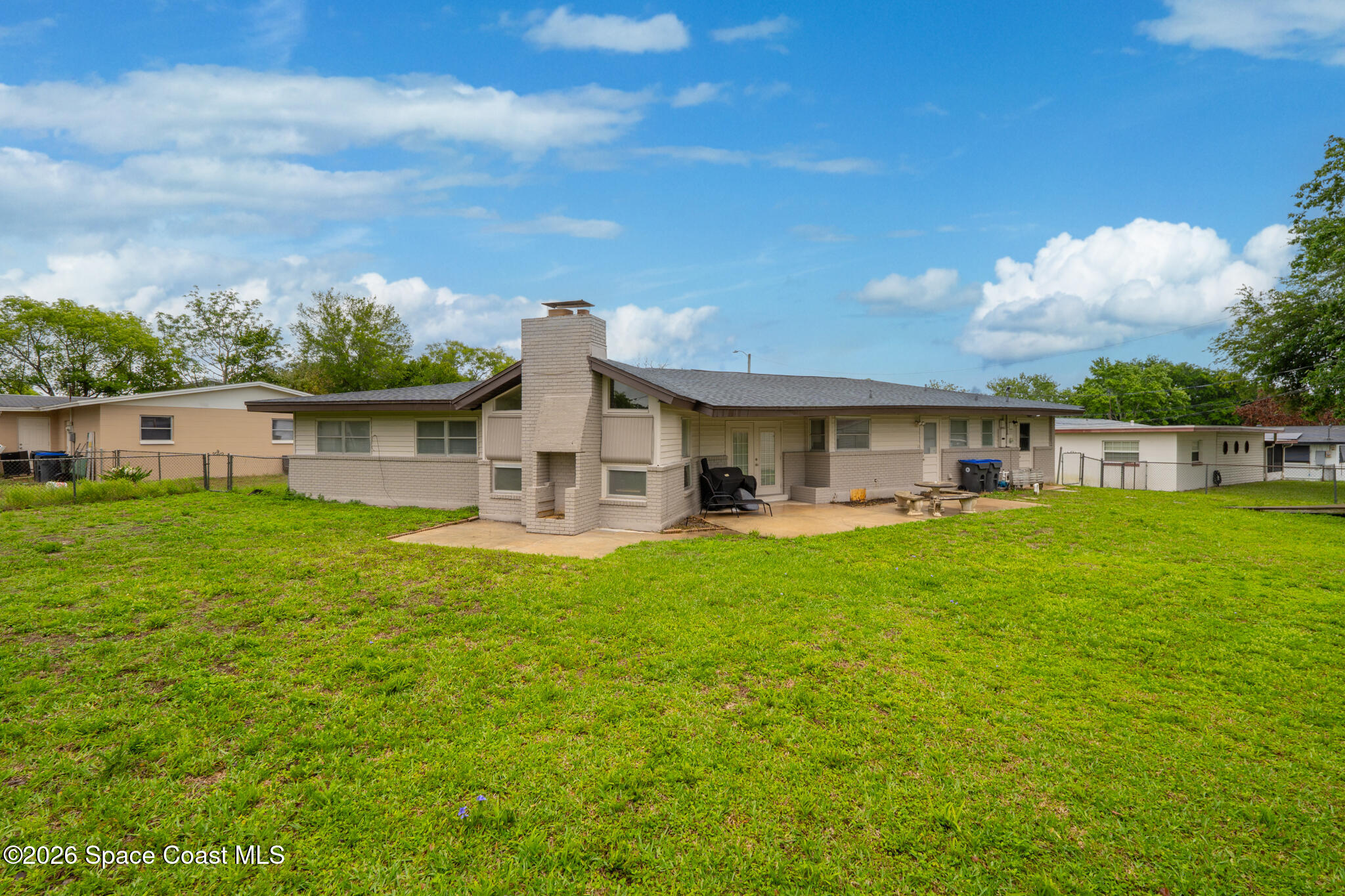 815 Glade Road Titusville, FL 32780 - Photo 24 of 30 a front view of house with yard and seating area