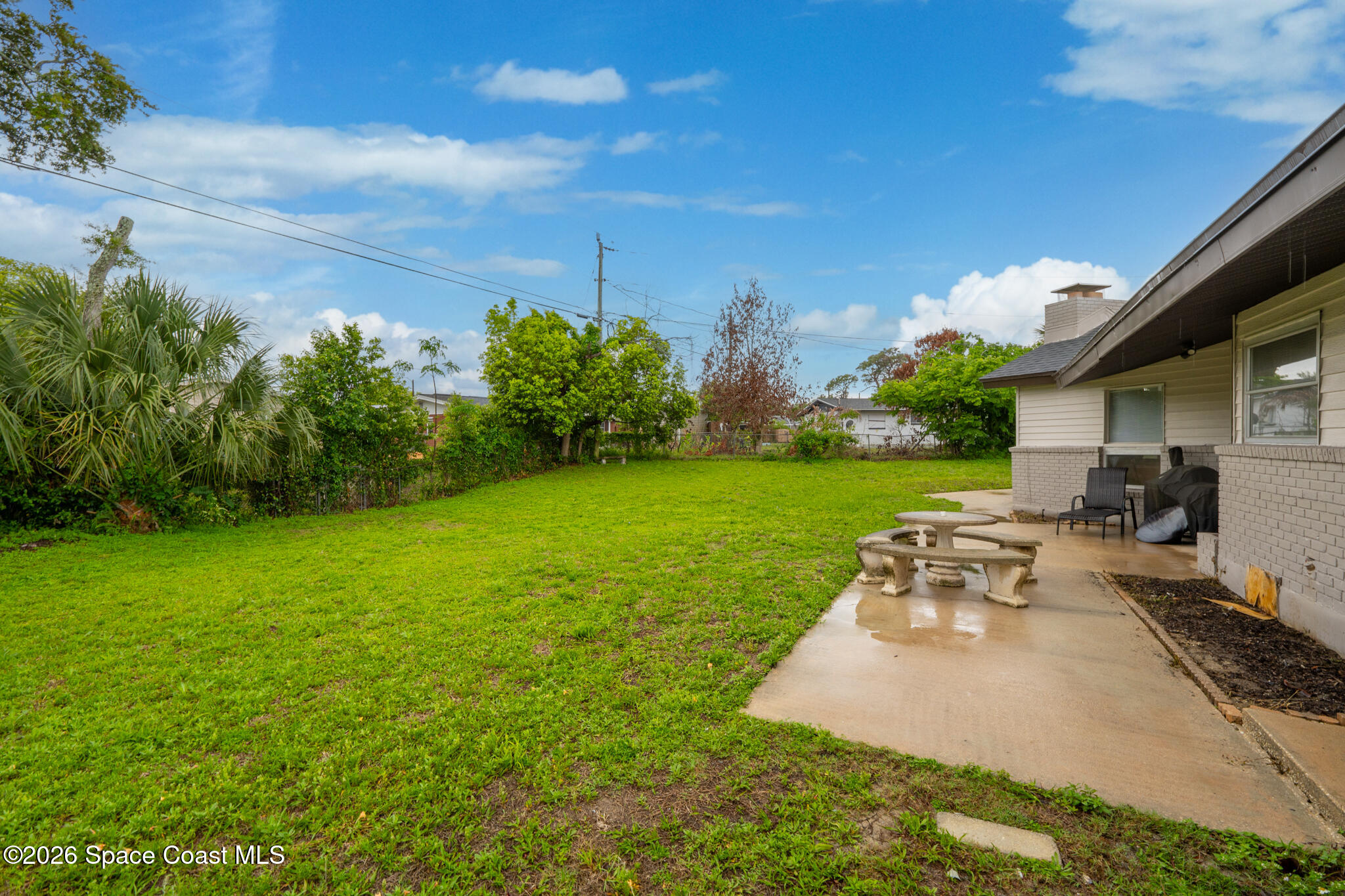 815 Glade Road Titusville, FL 32780 - Photo 25 of 30 a view of a backyard with sitting area