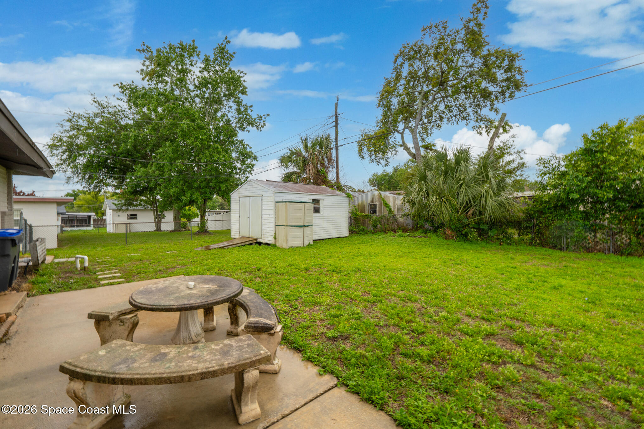 815 Glade Road Titusville, FL 32780 - Photo 26 of 30 a view of a house with a yard porch and sitting area