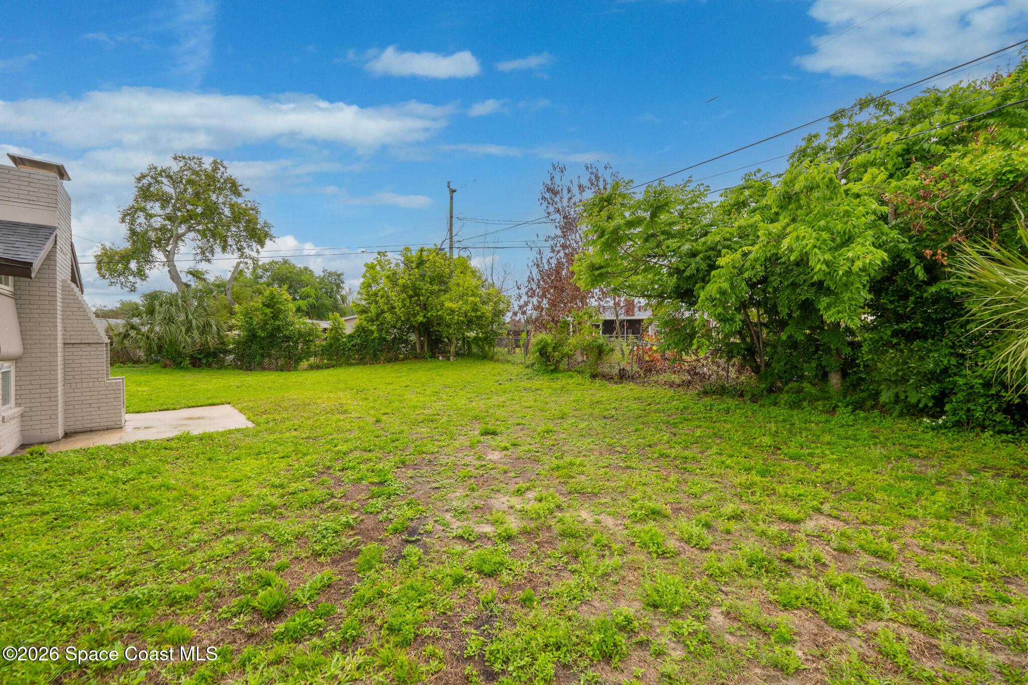 815 Glade Road Titusville, FL 32780 - Photo 28 of 30 a view of a garden with a building in the background