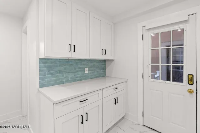 a bathroom with a sink a mirror and a shower