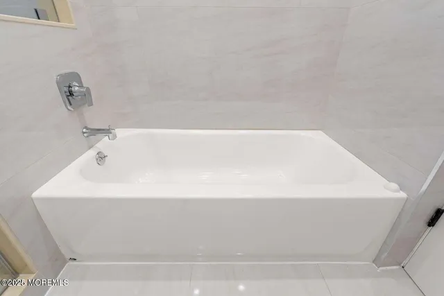 an empty room with wooden floor