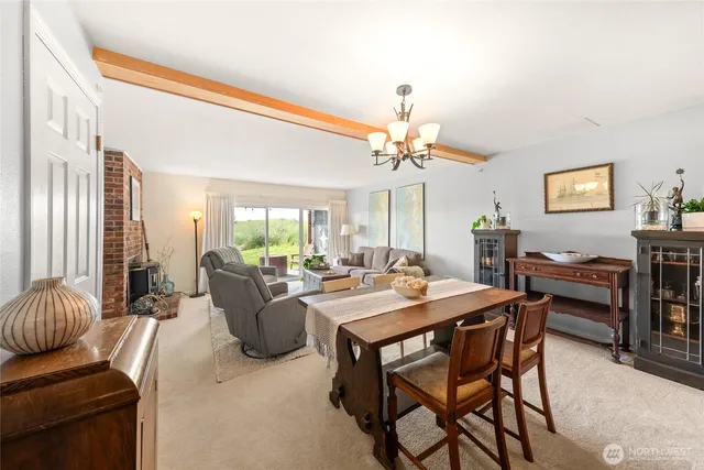 a view of a dining room with furniture window and outside view