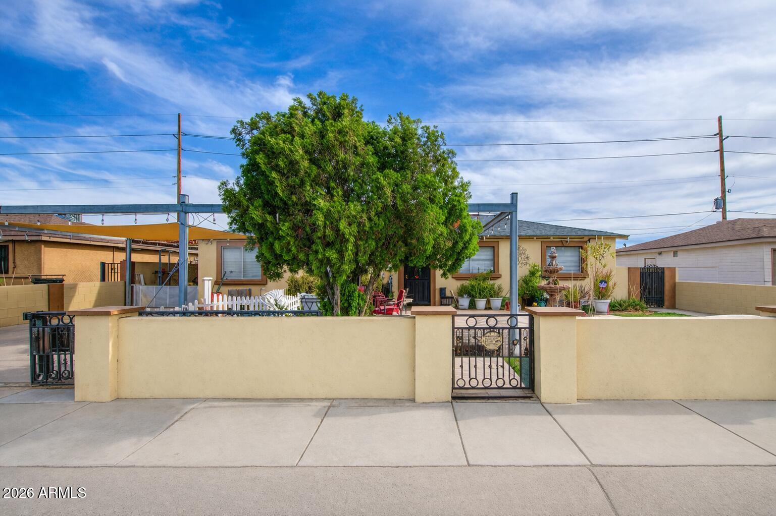 3107 West Montebello Avenue Phoenix, AZ 85017 - Photo 2 of 30 a view of a patio with table and chairs and potted plants