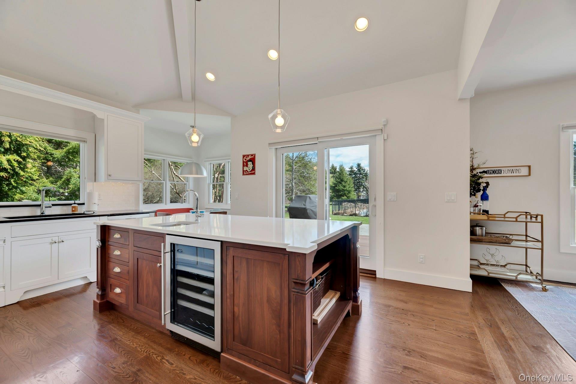450 Sterling Woods Lane Southold, NY 11971 - Photo 11 of 41 a kitchen with a stove and a refrigerator