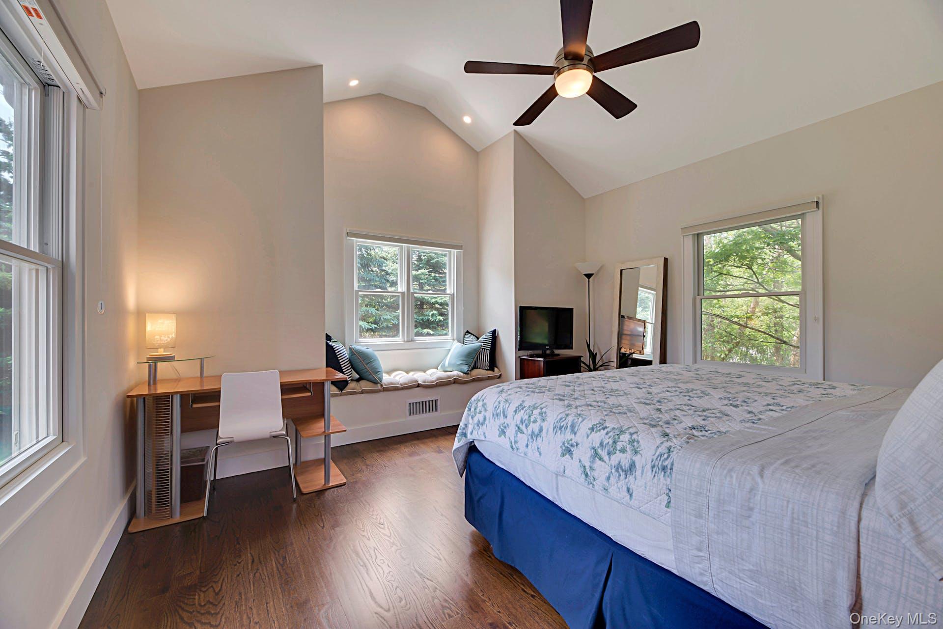 450 Sterling Woods Lane Southold, NY 11971 - Photo 13 of 41 a bedroom with a bed furniture and a window