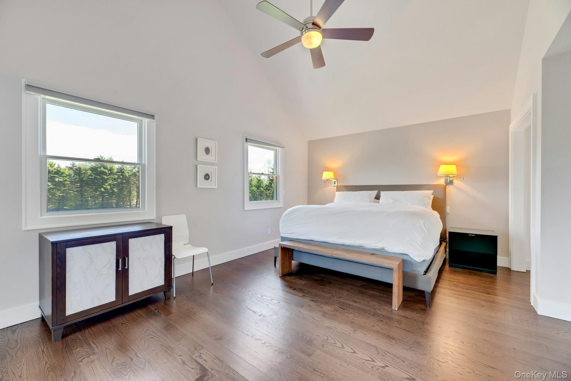 450 Sterling Woods Lane Southold, NY 11971 - Photo 15 of 41 a bedroom with a bed and a window