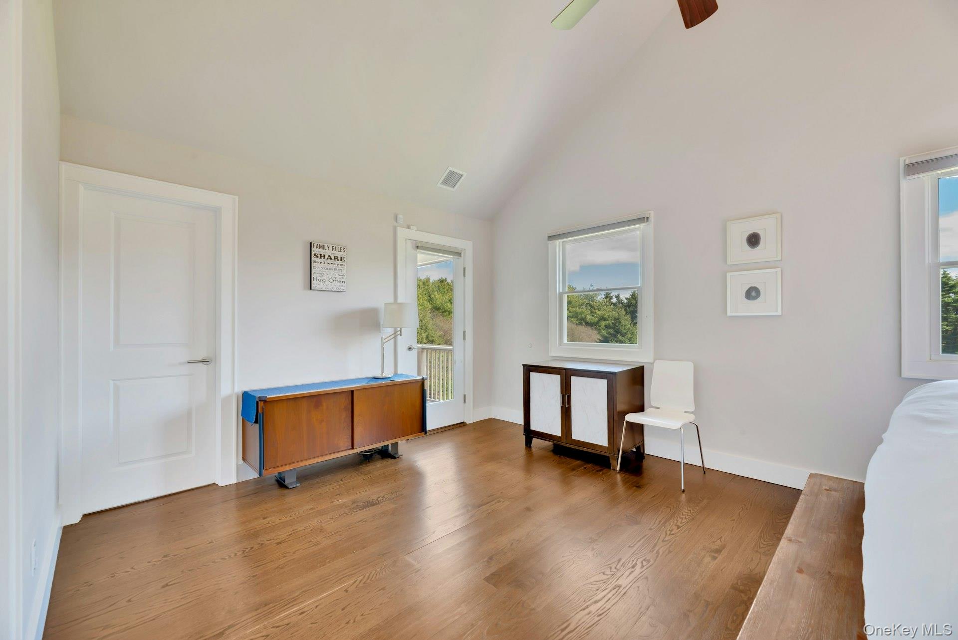 450 Sterling Woods Lane Southold, NY 11971 - Photo 16 of 41 a view of room with window and wooden floor