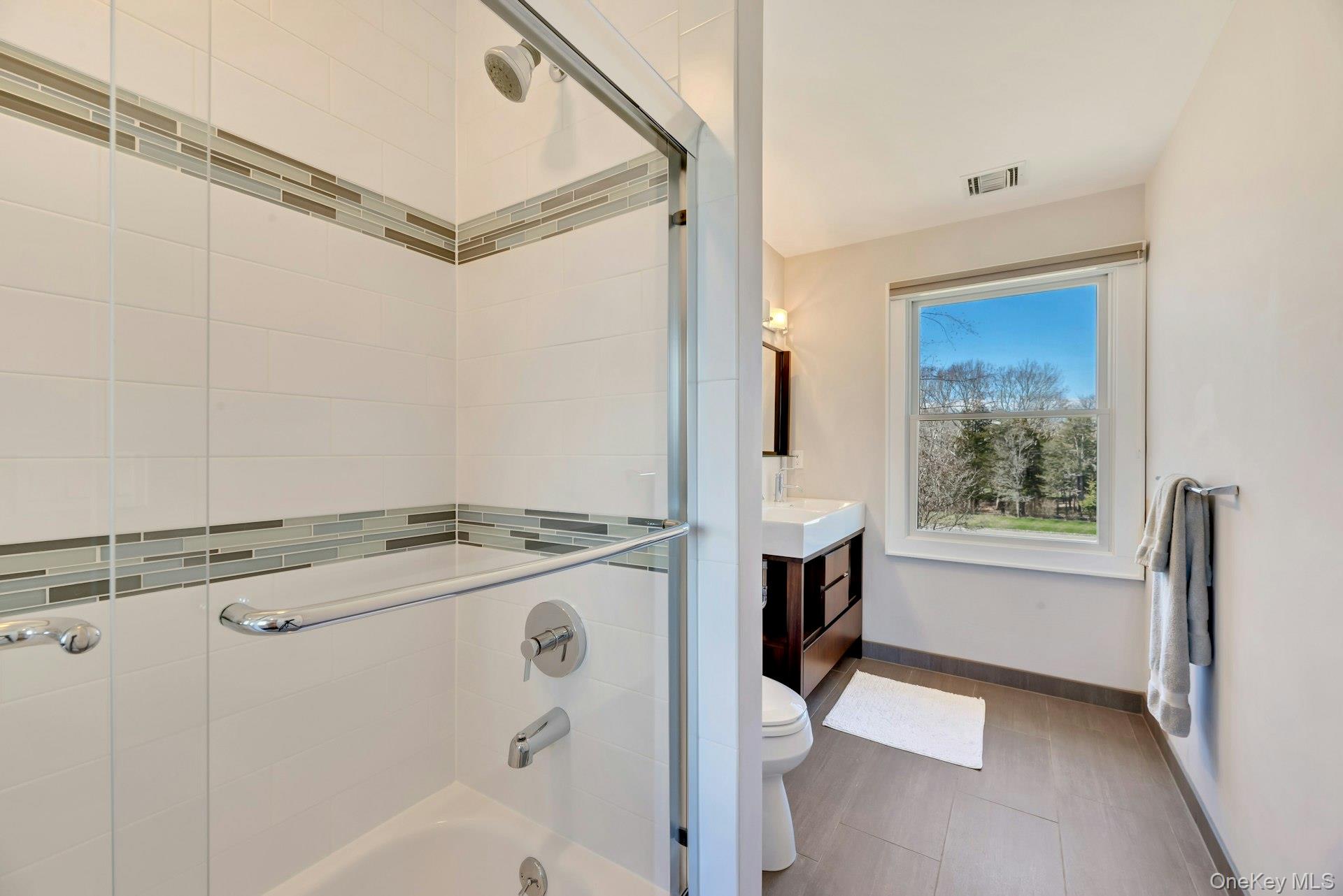 450 Sterling Woods Lane Southold, NY 11971 - Photo 24 of 41 a view of storage and utility room with washer and dryer
