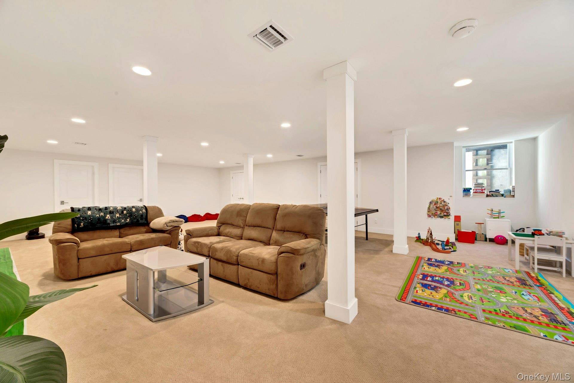 450 Sterling Woods Lane Southold, NY 11971 - Photo 26 of 41 a living room with furniture and a table