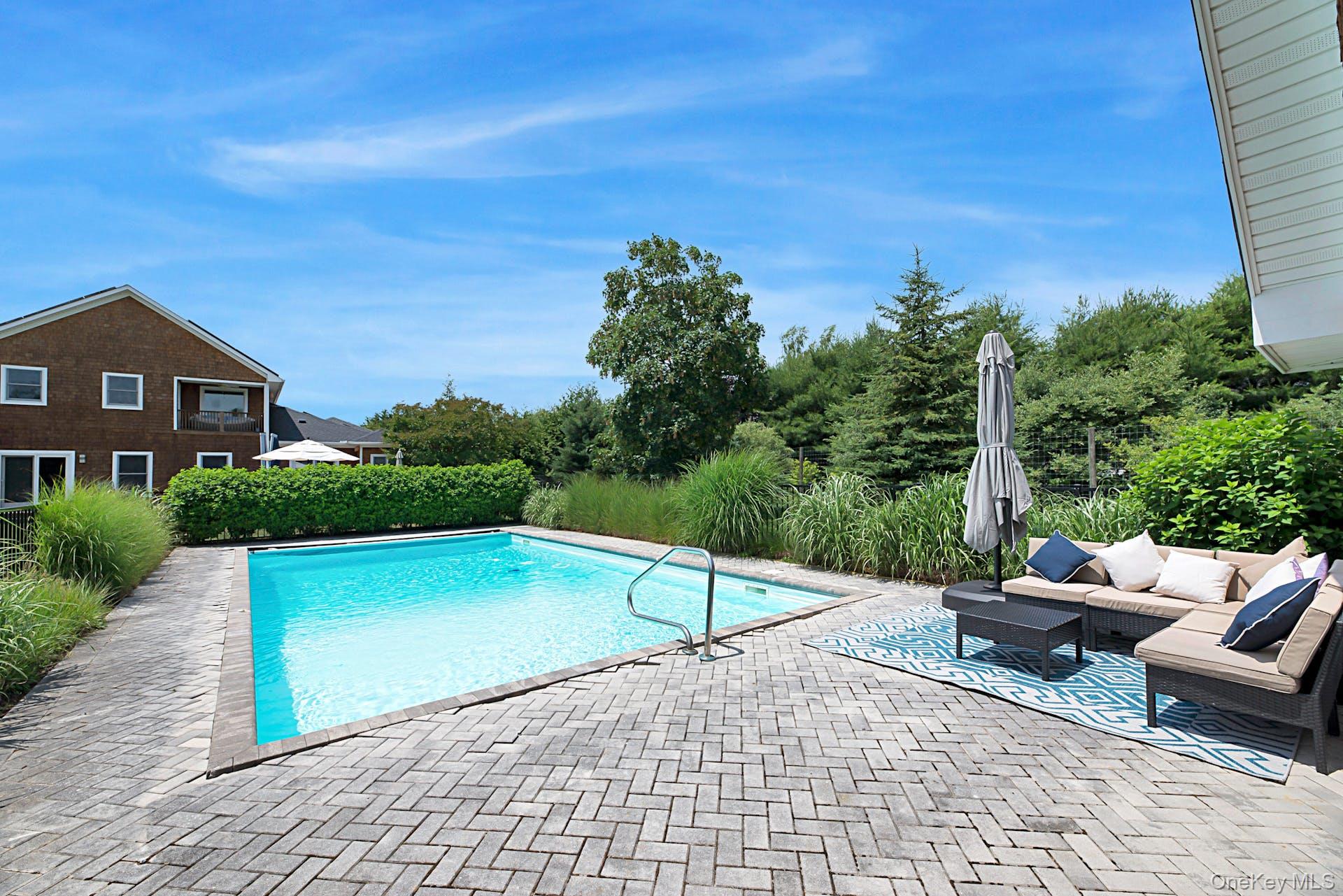 450 Sterling Woods Lane Southold, NY 11971 - Photo 29 of 41 a view of swimming pool with seating space