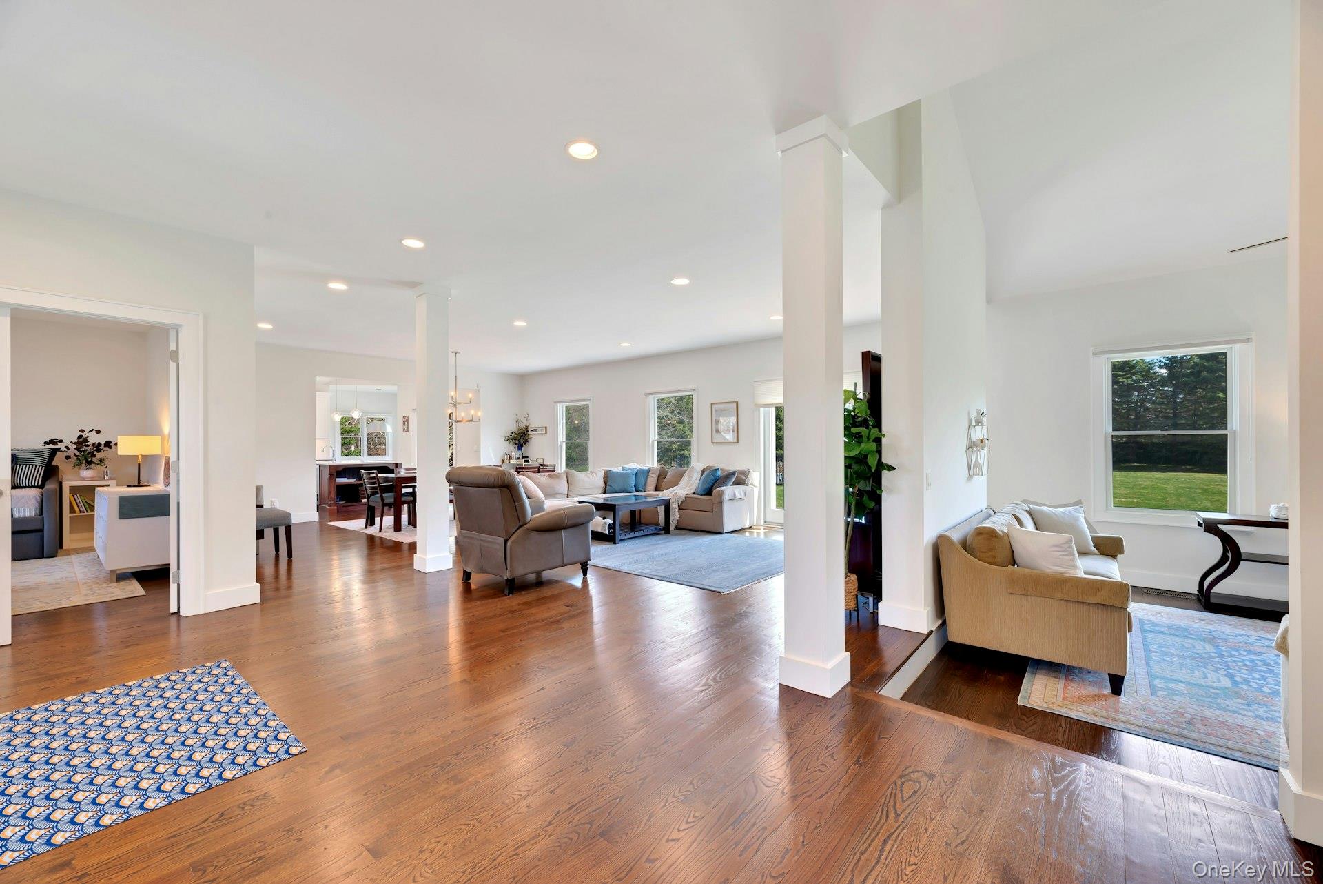 450 Sterling Woods Lane Southold, NY 11971 - Photo 4 of 41 a living room with furniture and wooden floor