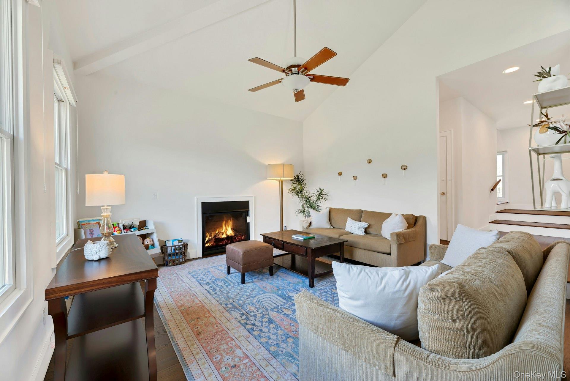 450 Sterling Woods Lane Southold, NY 11971 - Photo 7 of 41 a living room with furniture fireplace and a window