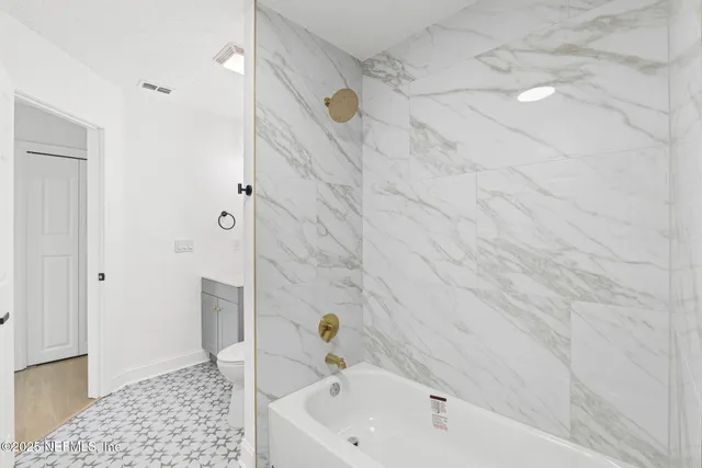 a bathroom with a sink and shower