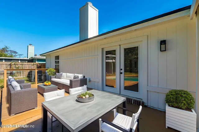 a view of a balcony with a barbeque