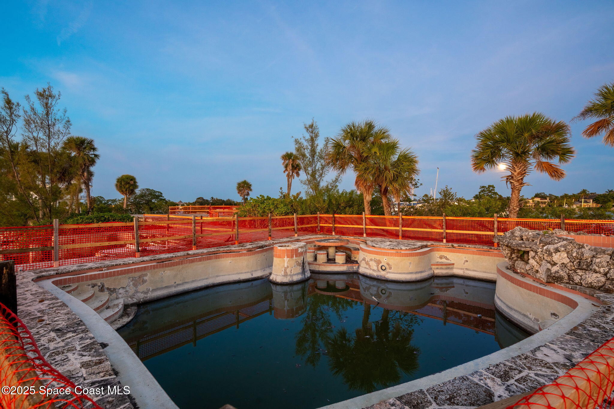 11680 Dragon Point Drive Merritt Island, FL 32952 - Photo 103 of 103 a view of a swimming pool with a yard and potted plants