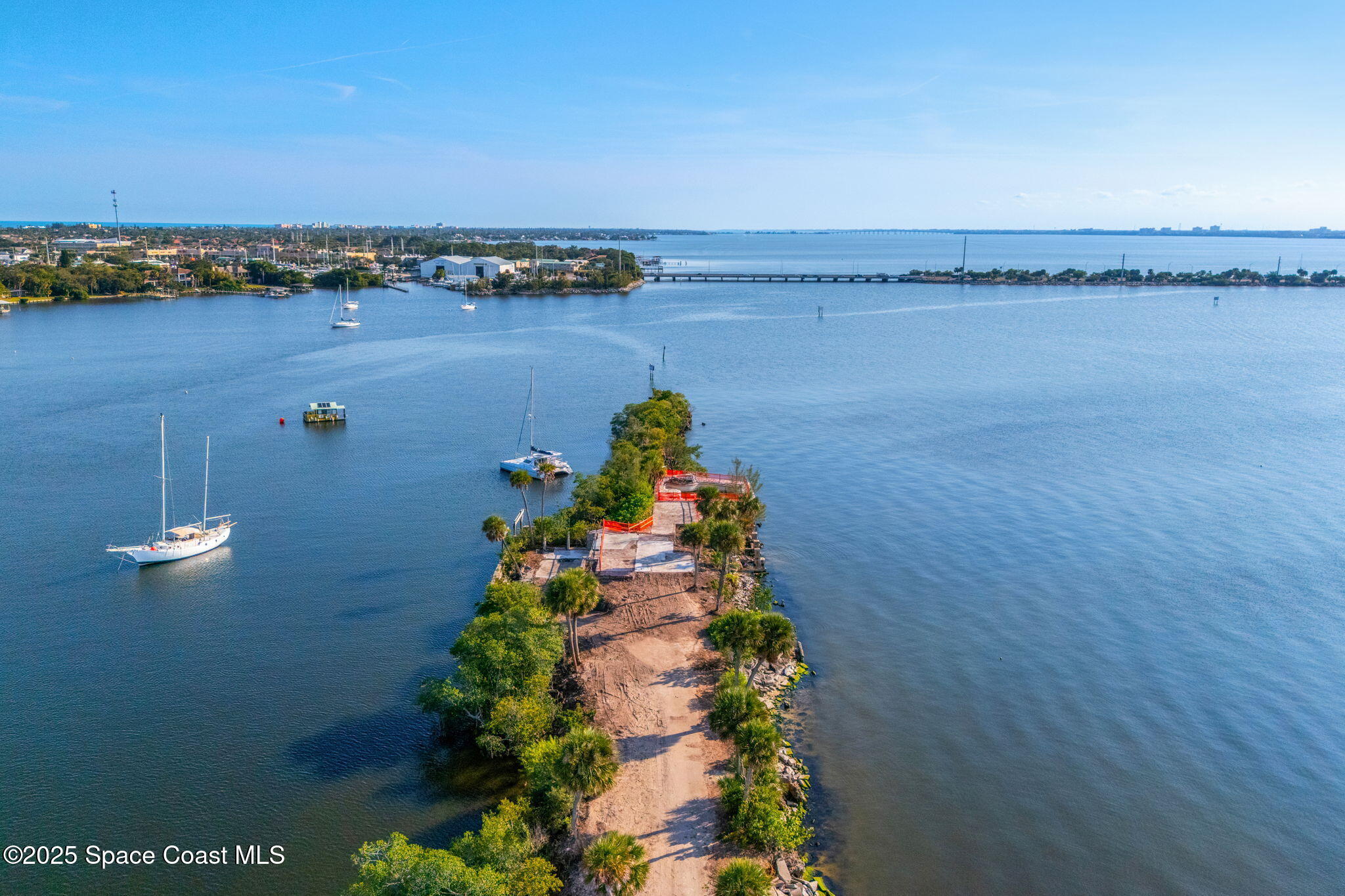 11680 Dragon Point Drive Merritt Island, FL 32952 - Photo 6 of 103 an aerial view of a house with a lake view