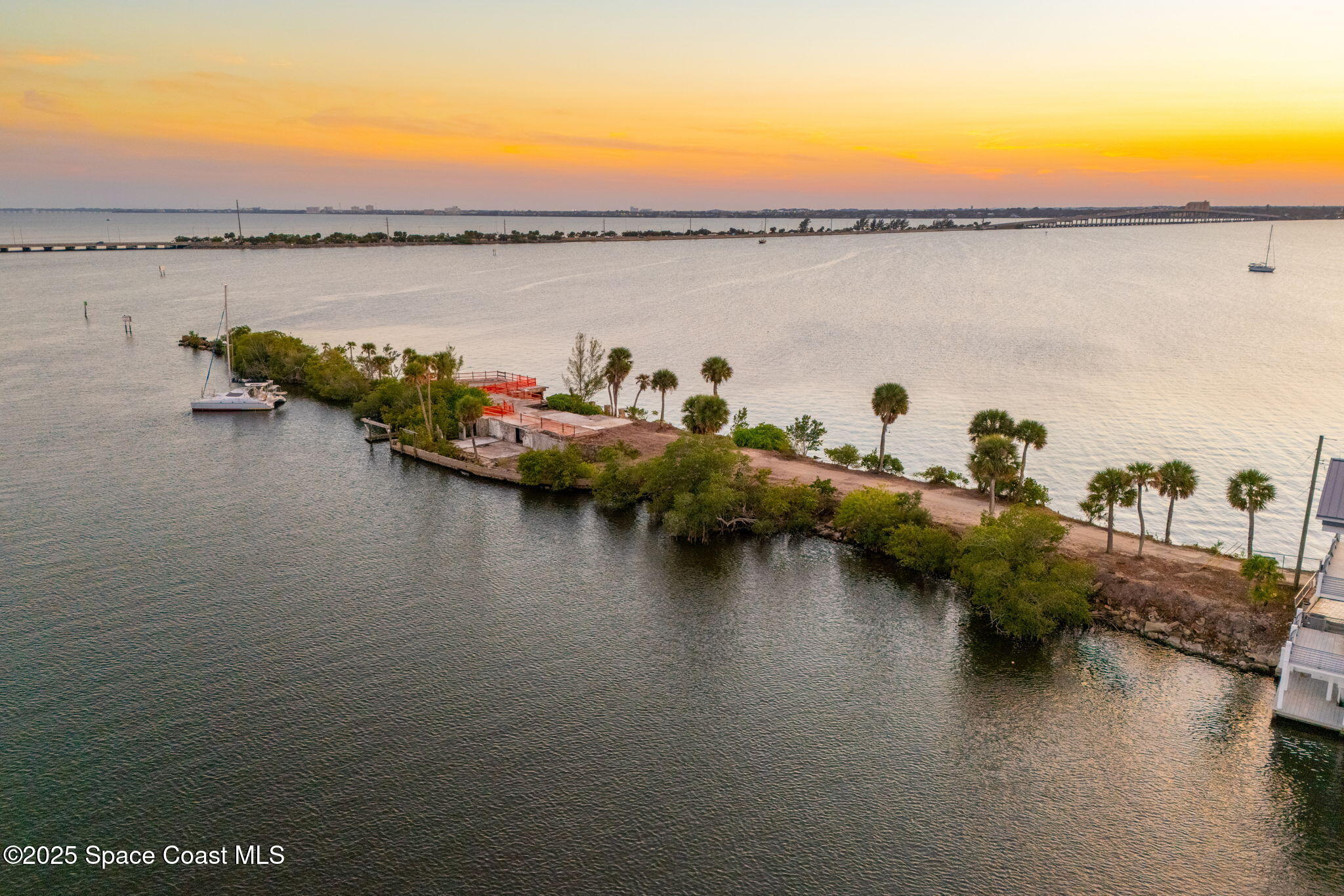 11680 Dragon Point Drive Merritt Island, FL 32952 - Photo 64 of 103 a view of a lake with boats and trees all around