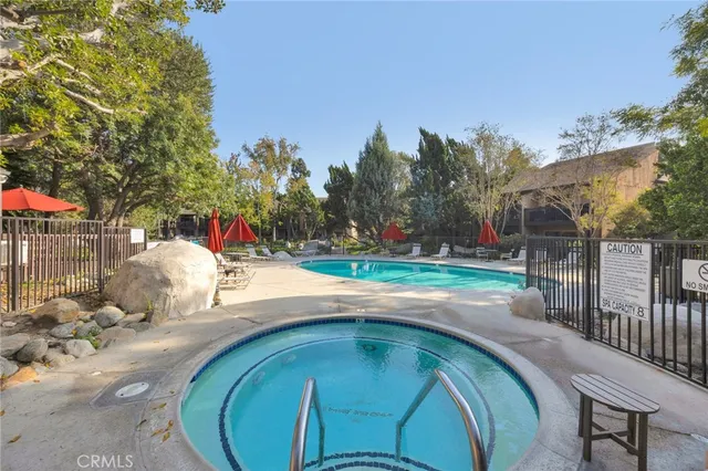 a view of a backyard with sitting area