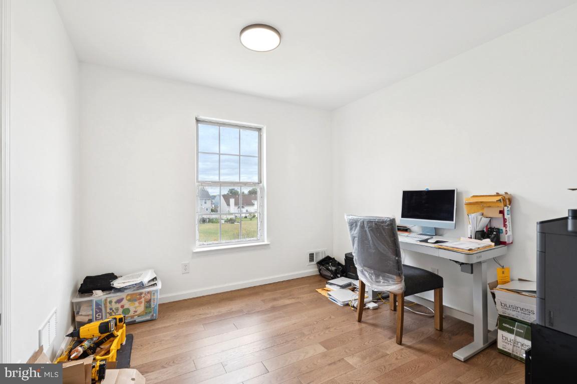 78 Kristopher Drive Hamilton, NJ 08620 - Photo 17 of 25 a view of a workspace with furniture and a window