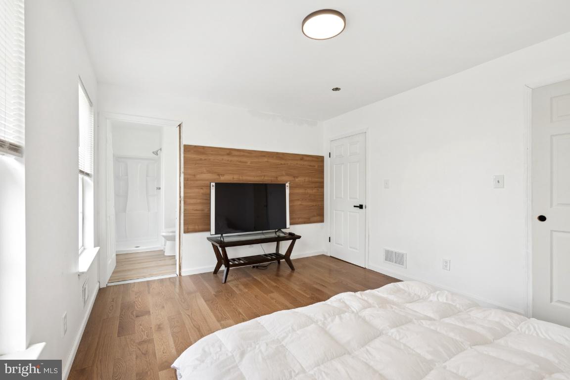 78 Kristopher Drive Hamilton, NJ 08620 - Photo 19 of 25 a view of a livingroom with wooden floor and a fireplace