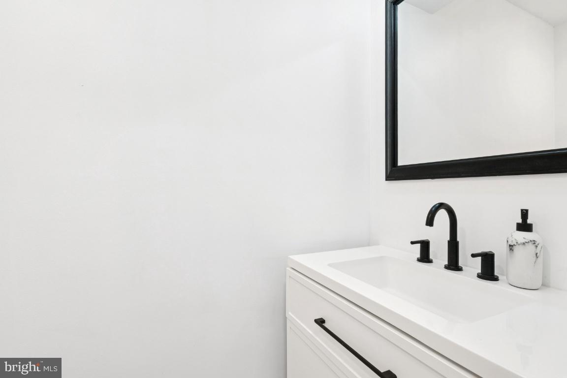 78 Kristopher Drive Hamilton, NJ 08620 - Photo 21 of 25 a bathroom with a sink and mirror