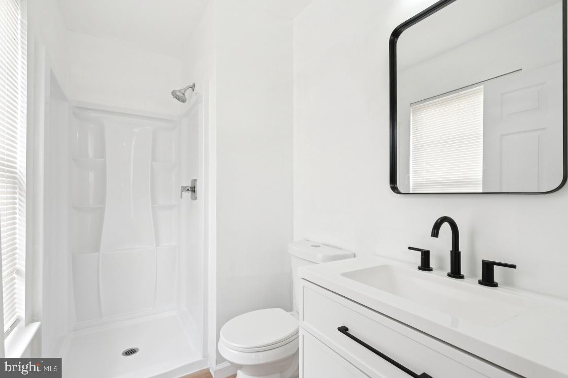 78 Kristopher Drive Hamilton, NJ 08620 - Photo 22 of 25 a bathroom with a sink a toilet and shower