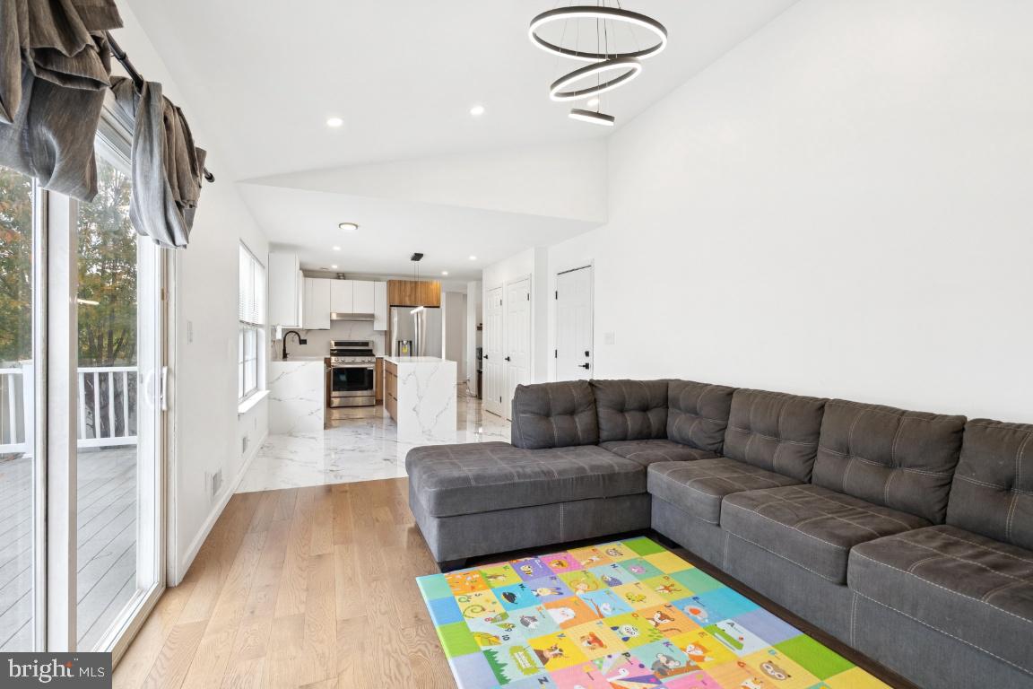 78 Kristopher Drive Hamilton, NJ 08620 - Photo 9 of 25 a living room with furniture and a rug