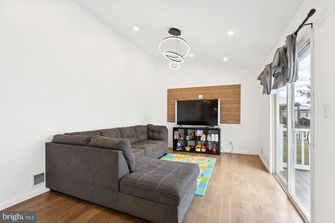 78 Kristopher Drive Hamilton, NJ 08620 - Photo 10 of 25 a living room with furniture and a flat screen tv