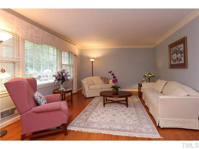 604 Macon Place Raleigh, NC 27609 - Photo 11 of 25 Hardwood flooring and large bright windows make this living room have many options. Formal Livin