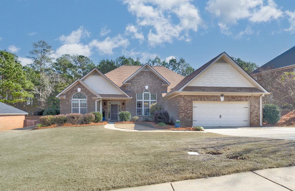 6712 Bridge Way Columbus, GA 31904 - Photo 36 of 36 a front view of a house with a yard and garage