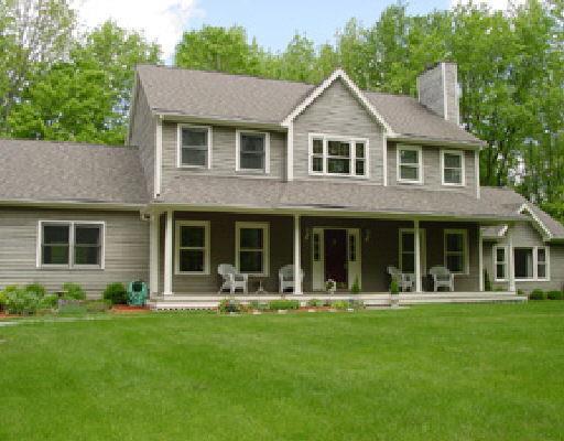 141 Limekiln Road Ridgefield, CT 06877 - Photo 1 of 1 a front view of a house with garden and porch